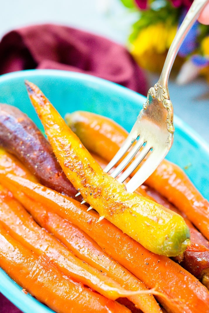These Orange Braised Carrots are bound to be a highlight on your dinner table! Made with fresh-squeezed orange juice, butter, shallots, black pepper, and turmeric, this is one delicious side dish recipe!