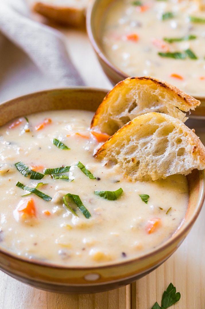 Creamy Wild Rice Soup is the perfect slow cooker soup for cold winter nights and loaded with a wild rice blend fresh, carrots, and celery.