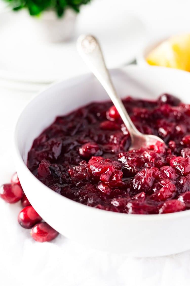 This Bourbon Orange Cranberry Sauce is loaded with tart and zesty flavor! Made with fresh cranberries, orange juice, orange zest, and bourbon on the stove and ready in less than 30 minutes.