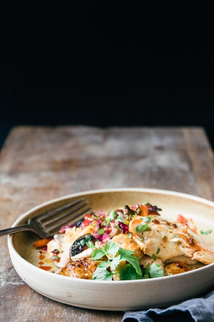 This spicy and aromatic Harissa chicken tray bake is a simple yet impressive dinner that will become a new family classic. Crispy golden skinned chicken, smothered with spicy Harissa paste and roasted on top of seasonal vegetables.