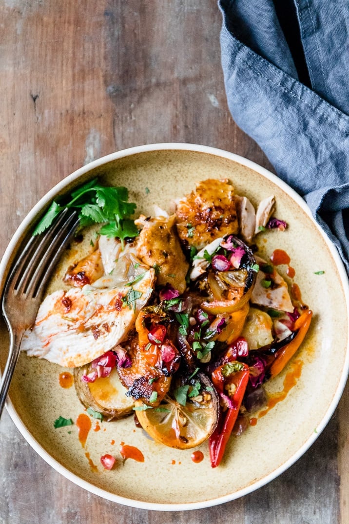 This spicy and aromatic Harissa chicken tray bake is a simple yet impressive dinner that will become a new family classic. Crispy golden skinned chicken, smothered with spicy Harissa paste and roasted on top of seasonal vegetables.