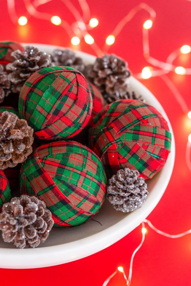 These DIY Holiday Rag Balls are a simple way to add a bit of holiday charm to your home. This craft project is super easy to make with just 4 materials! Makes great ornaments and party favors too!