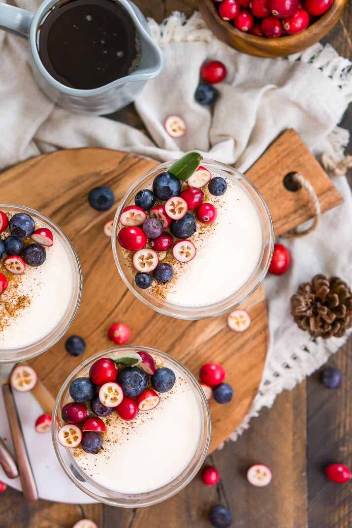 Maple Panna Cotta topped with brown sugar, nutmeg, blueberries, and cranberries