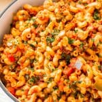 American Chop Suey is a delicious and easy dinner recipe made with ground beef, tomato, onion, green pepper, macaroni, and spices. Pure comfort food made on the stovetop in just 30 minutes and makes a great weeknight dinner!