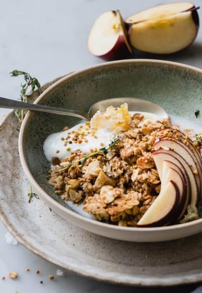 Warm Granola Breakfast Bowl is the perfect cozy start to any morning. Healthy oats, sweet, natural maple syrup and toasted almonds and coconut. These are the winter equivalent of a warm hug on a cold day.