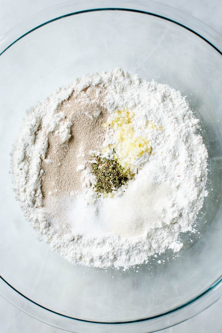 Preparing flour mixture for garlic parmesan breadsticks