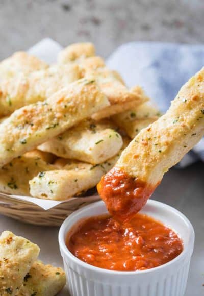 These homemade garlic parmesan breadsticks are so delicious and tempting. Fresh garlic, parmesan and subtle flavors of herbs make these breadsticks the best ever! And they are super easy to prepare.