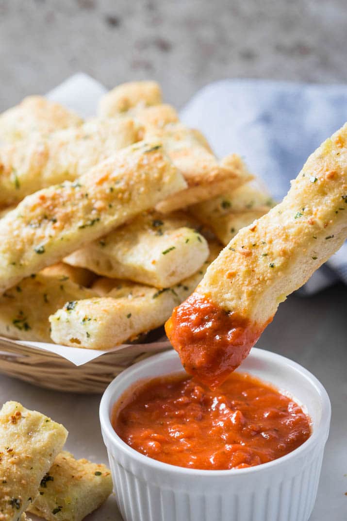 These homemade garlic parmesan breadsticks are so delicious and tempting. Fresh garlic, parmesan and subtle flavors of herbs make these breadsticks the best ever! And they are super easy to prepare.