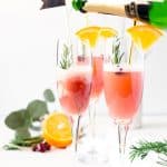  This Cranberry Orange Mimosa is the perfect cocktail for winter brunch! Made with cranberry and orange juice and champagne it's a fruity drink that you can serve up for Christmas or New Year's Eve or any other weekend celebration!