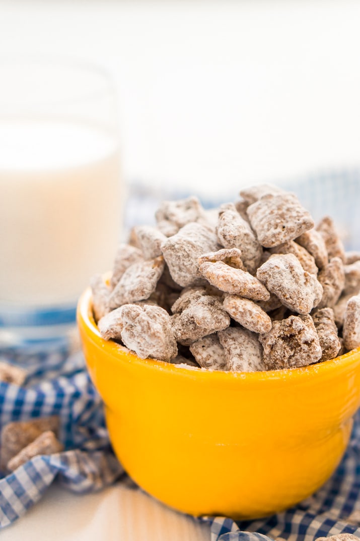 This Muddy Buddies or Puppy Chow recipe is an easy and addictive treat perfect for everyday celebrations and the holidays! Loaded with butter, chocolate, peanut butter, and powdered sugar, and ready in just 15 minutes!