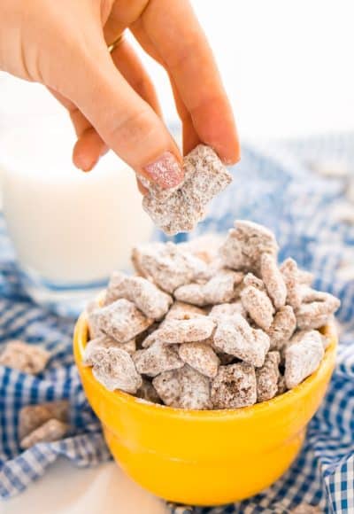 This Muddy Buddies or Puppy Chow recipe is an easy and addictive treat perfect for everyday celebrations and the holidays! Loaded with butter, chocolate, peanut butter, and powdered sugar, and ready in just 15 minutes!