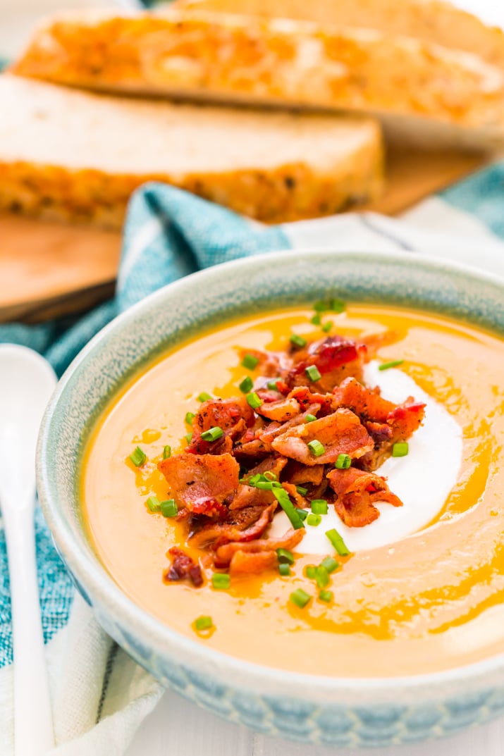 This Sweet Potato Soup is a creamy and filling dinner recipe that's made on the stovetop with onion, sweet potatoes, cream, stock, garlic, and spices! A comforting soup recipe for special occasions or chilly nights!