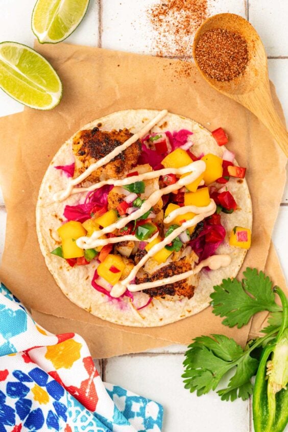 Overhead photo of blackened fish tacos on a piece of parchment.