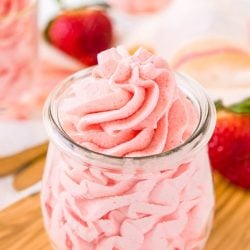 This Strawberry Frosting is so easy to make with just 3 ingredients. It's a light, fluffy, and delicious pink frosting you can use on cupcakes, cakes, and more!