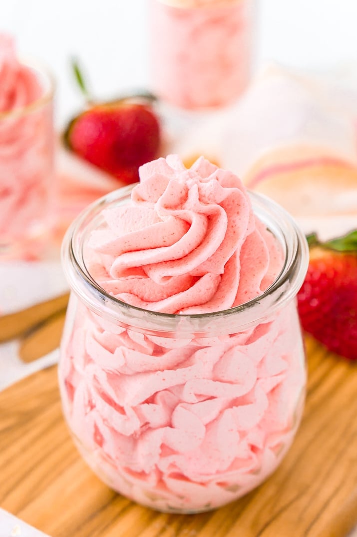 This Strawberry Frosting is so easy to make with just 3 ingredients. It's a light, fluffy, and delicious pink frosting you can use on cupcakes, cakes, and more!