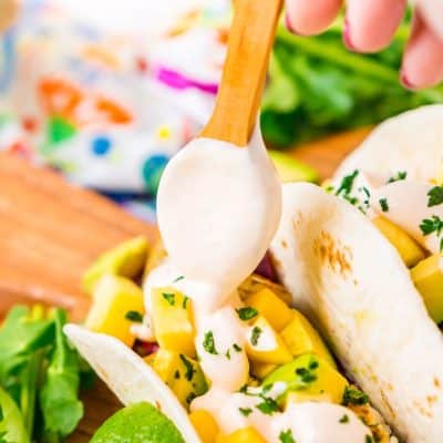 This Fish Taco Sauce is the ultimate topping for fish tacos. It's a creamy a delicious blend of sour cream, mayonnaise, lime juice, sriracha, garlic, and cumin.