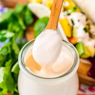 This Fish Taco Sauce is the ultimate topping for fish tacos. It's a creamy a delicious blend of sour cream, mayonnaise, lime juice, sriracha, garlic, and cumin.