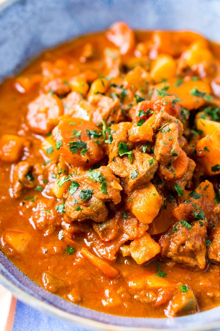 This Hungarian Goulash recipe is a rich and hearty dinner loaded with beef, carrots, potatoes, sweet paprika, and more. An easy stew recipe that reheats well and tastes delicious!