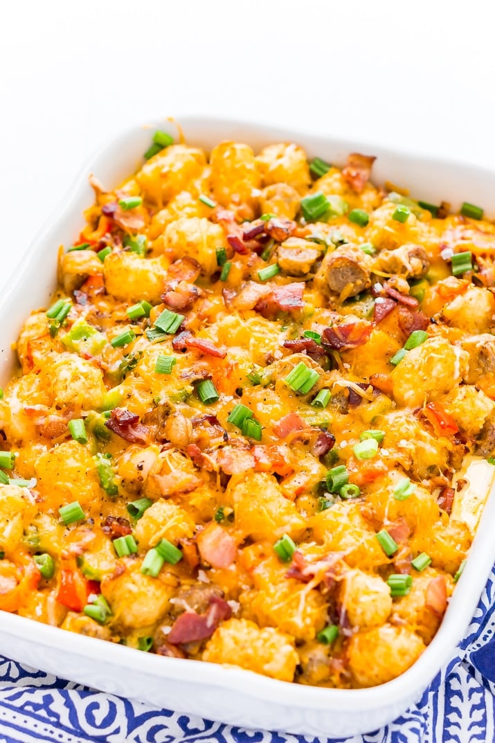 Tater Tot Breakfast Casserole in a white pan on blue napkin