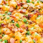 This Tater Tot Breakfast Casserole is an easy and delicious savory breakfast recipe the whole family will love! Everyone will love the mix of bacon, sausage, peppers, cheesy and more mixed into this tasty recipe!
