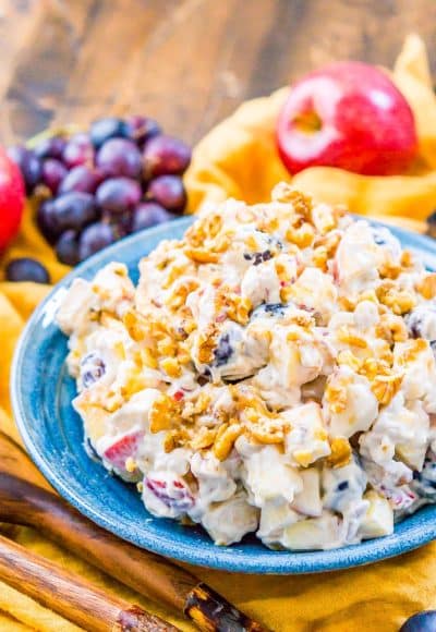 This Apple Grape Salad is a vintage dessert salad made with cream cheese, yogurt, apples, grapes, walnuts, and sugar! It's a potluck favorite and everyone will want the recipe!