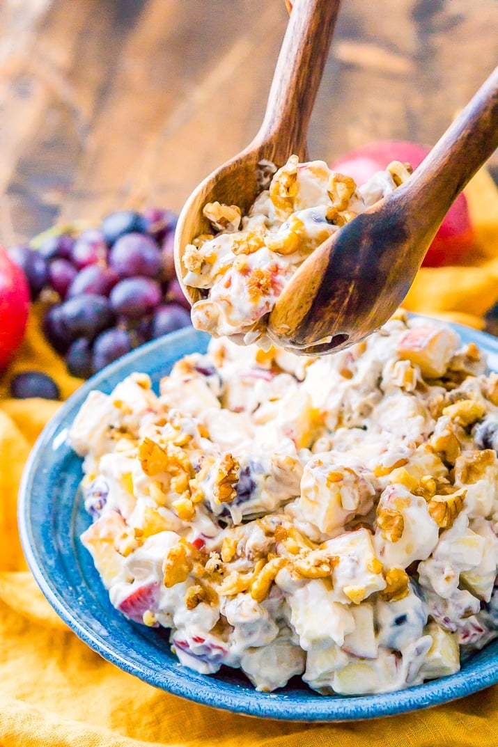 This Apple Grape Salad is a vintage dessert salad made with cream cheese, yogurt, apples, grapes, walnuts, and sugar! It's a potluck favorite and everyone will want the recipe!