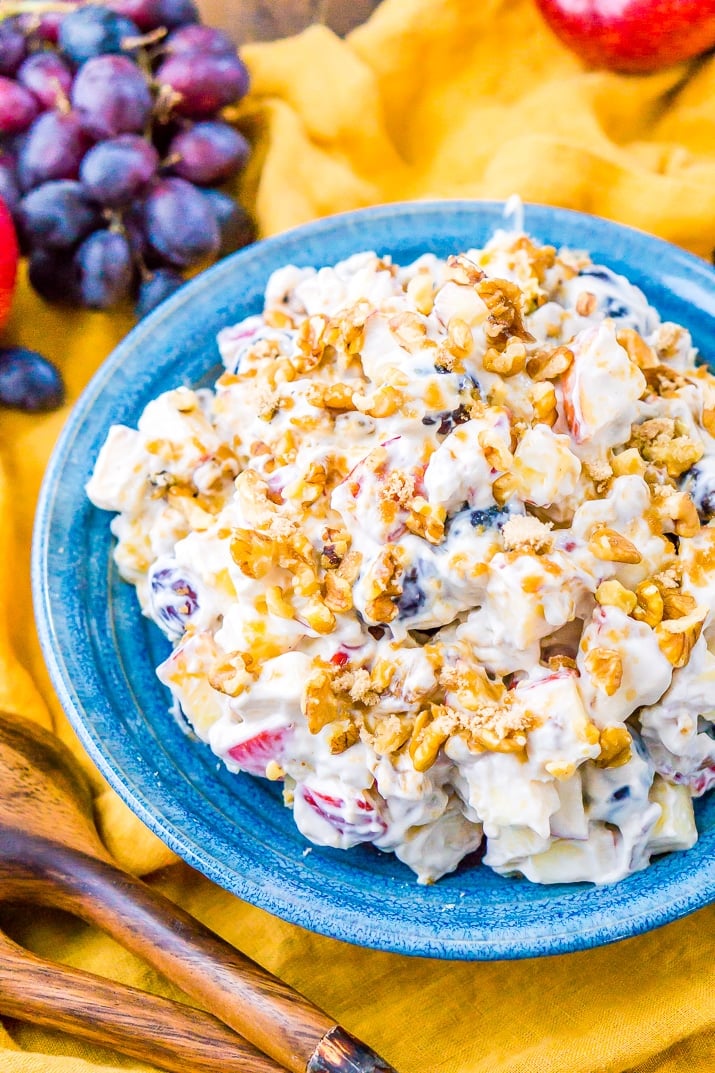 This Apple Grape Salad is a vintage dessert salad made with cream cheese, yogurt, apples, grapes, walnuts, and sugar! It's a potluck favorite and everyone will want the recipe!