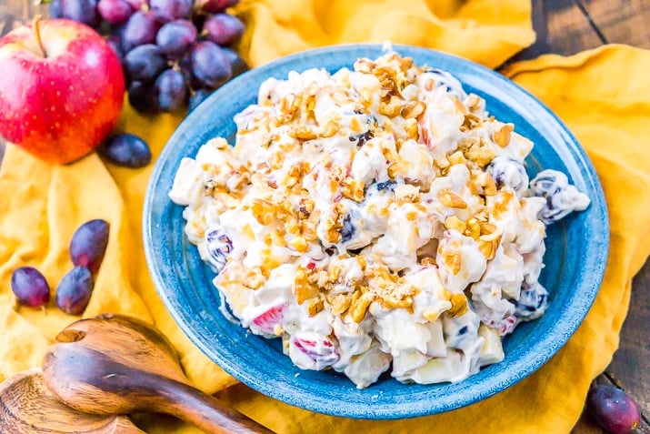 This Apple Grape Salad is a vintage dessert salad made with cream cheese, yogurt, apples, grapes, walnuts, and sugar! It's a potluck favorite and everyone will want the recipe!