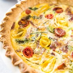 This hearty, crowd-pleasing Bacon Onion Spinach Quiche only looks fancy! The preparation is beyond simple, but the final product is sure to become your new favorite breakfast dish!