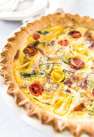 This hearty, crowd-pleasing Bacon Onion Spinach Quiche only looks fancy! The preparation is beyond simple, but the final product is sure to become your new favorite breakfast dish!