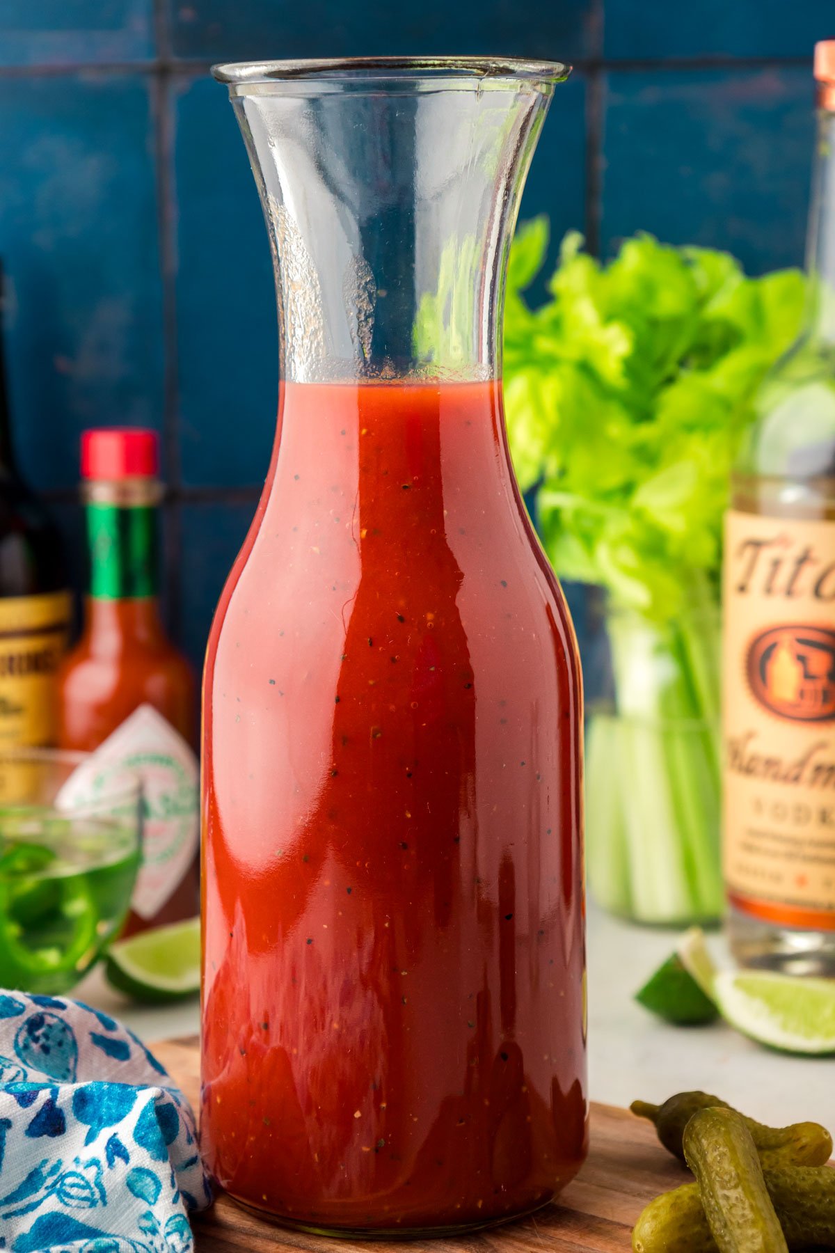 A carafe of bloody mary mixture.