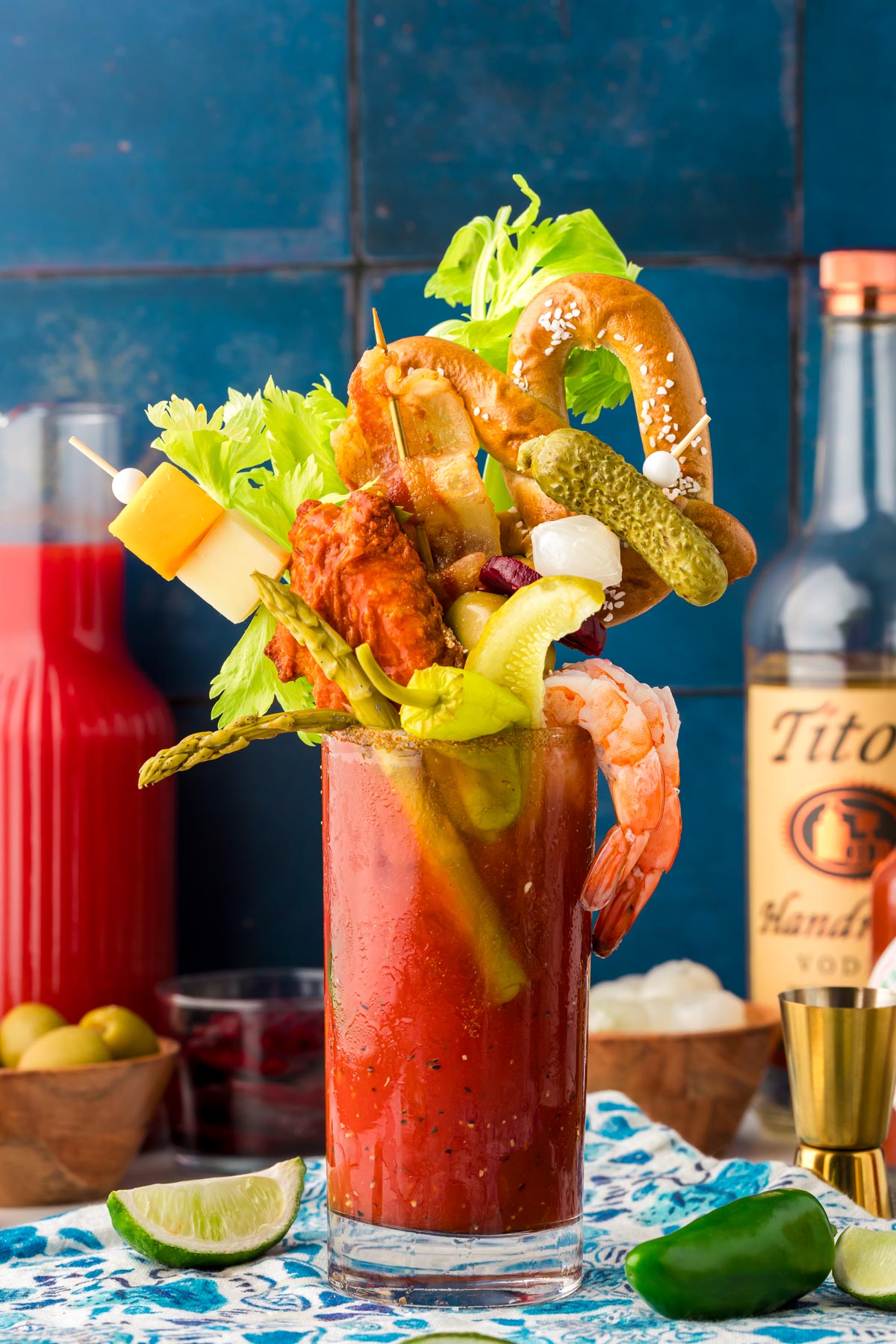 A glass filled with a Bloody Mary topped with extravagant garnishes for brunch.