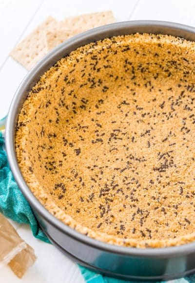 This is the Best Graham Cracker Crust Recipe for all of your desserts both baked and no-bake! This crust is made with graham crackers, butter, sugar, and an ingredient that makes it better than all the rest! Deep dish and standard measurements included!