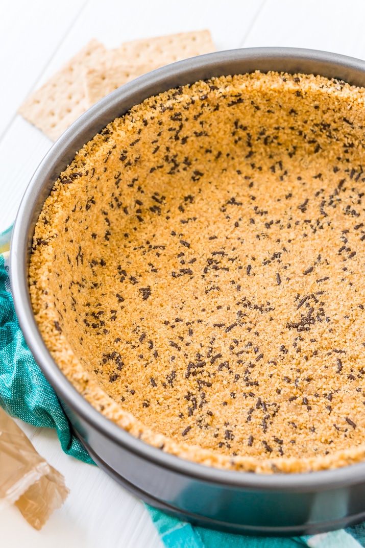 This is the Best Graham Cracker Crust Recipe for all of your desserts both baked and no-bake! This crust is made with graham crackers, butter, sugar, and an ingredient that makes it better than all the rest! Deep dish and standard measurements included!