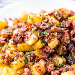 This Corned Beef Hash is a salty and delicious breakfast dish the whole family will love! A simple hash made with brisket, potatoes, onions, butter, thyme, and pepper and a great way to use up leftover Corned Beef!