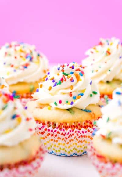 These Birthday Cupcakes are a delicious and fluffy vanilla almond cake that's loaded with sprinkles and topped with an easy and addictive whipped frosting!