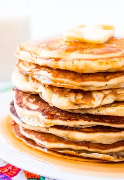 The Best Homemade Buttermilk Pancakes are the perfect weekend breakfast! They're made from scratch and super fluffy and buttery and delicious! Just top with butter and syrup and you're golden!