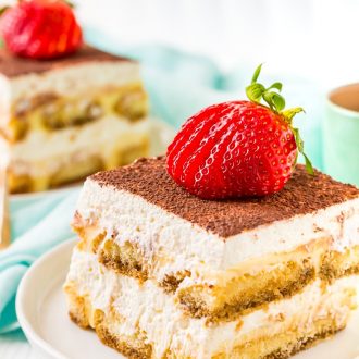 This Boozy Tiramisu recipe swaps out traditional coffee for a rich coffee liqueur. It's a shortcut version made with mascarpone laced pudding instead of a traditional egg custard. Topped with a silky vanilla whipped cream.