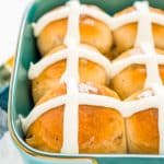 These Hot Cross Buns are a spiced sweet bun loaded with currants or raisins and topped with vanilla icing. They're a traditional Good Friday and Easter recipe!