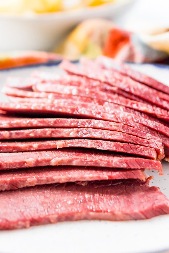 Sliced up corned beef on plate