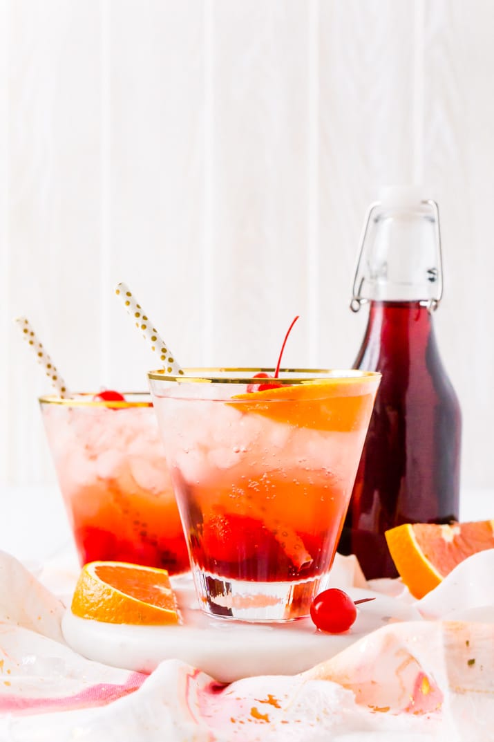 Shirley Temple Drink with bottle of granadine