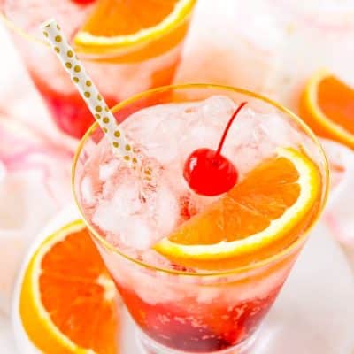 This Shirley Temple drink is a classic and nostalgic mocktail recipe made with homemade grenadine, ginger ale, ice, and an orange slice!