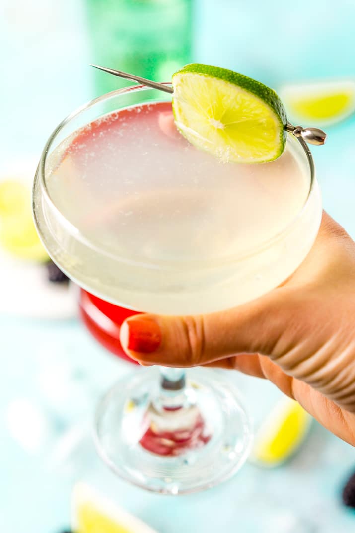 Classic Gimlet cocktail in woman's hand