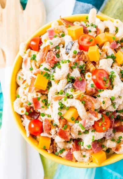 This Chicken Bacon Ranch Pasta Salad is going to be an instant hit at BBQs and picnics this summer! It's loaded with chicken, bacon, cheese, olives, and coated with a delicious ranch dressing.