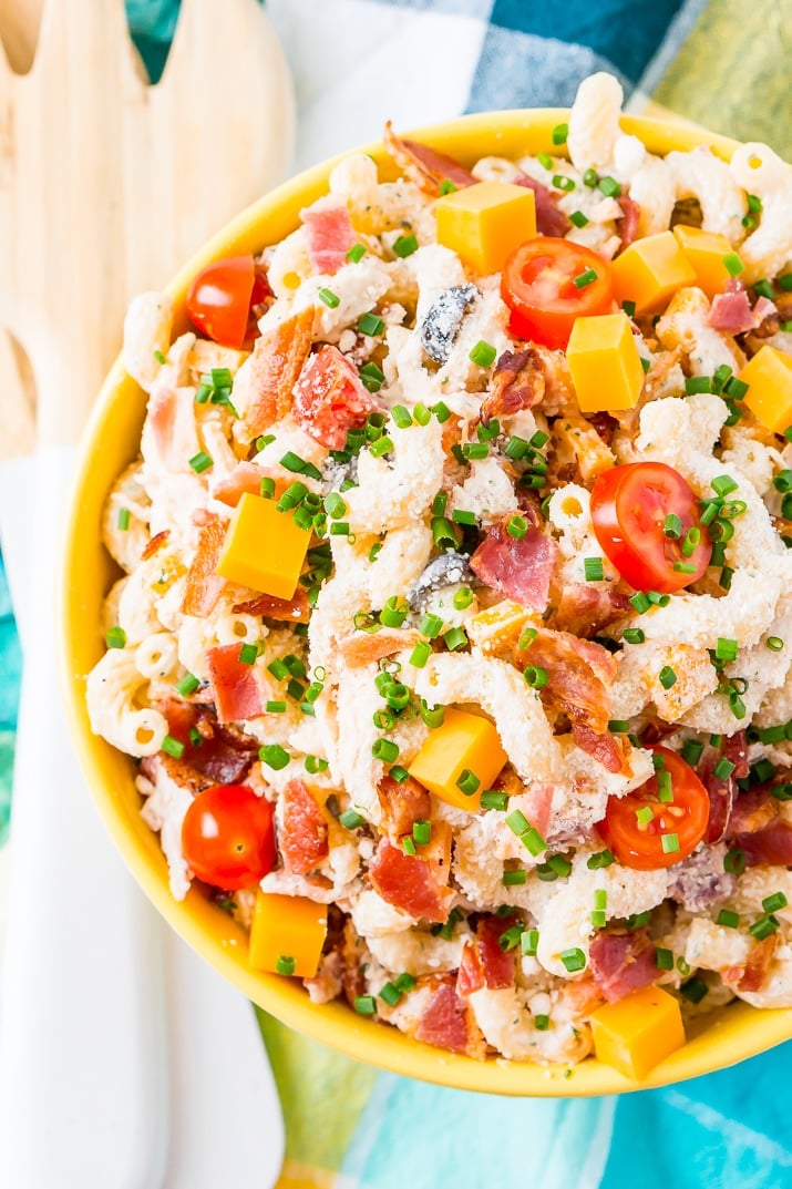 This Chicken Bacon Ranch Pasta Salad is going to be an instant hit at BBQs and picnics this summer! It's loaded with chicken, bacon, cheese, olives, and coated with a delicious ranch dressing.