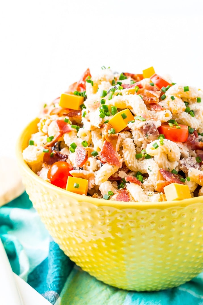 This Chicken Bacon Ranch Pasta Salad is going to be an instant hit at BBQs and picnics this summer! It's loaded with chicken, bacon, cheese, olives, and coated with a delicious ranch dressing.