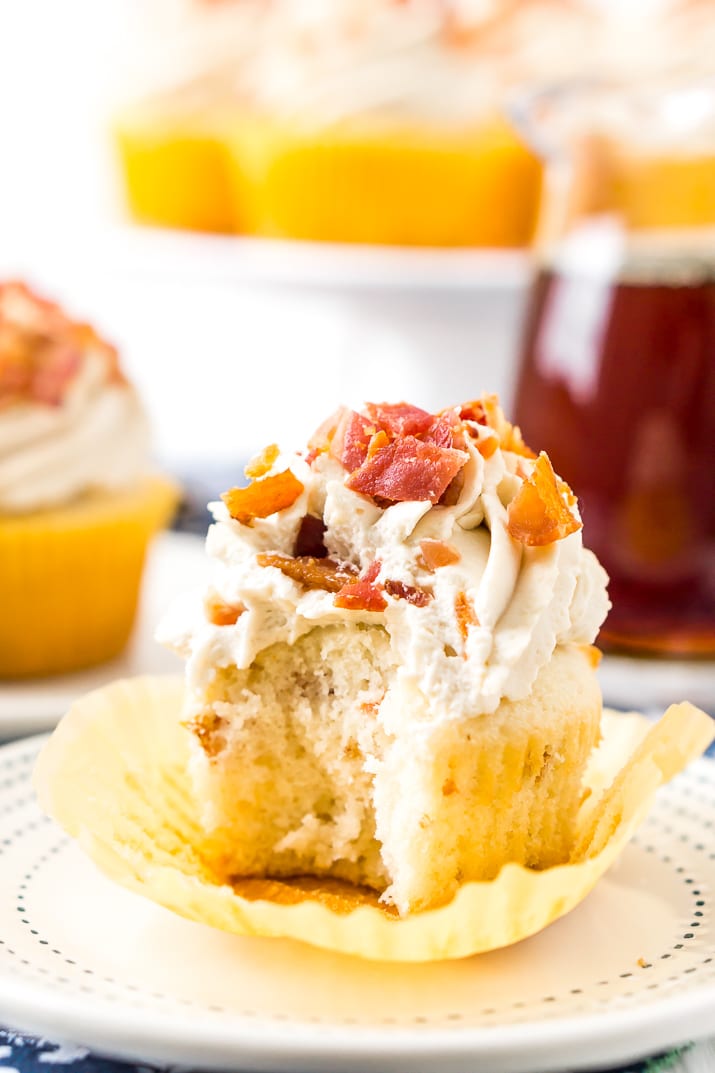 Maple Bacon Cupcakes with bite taken out of it.