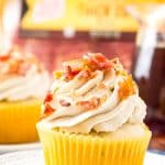 Coffee Maple Bacon Cupcakes consist of maple-infused vanilla cupcakes loaded with pieces of freshly cooked bacon. These treats are topped with a generous swirl of coffee-flavored whipped cream!