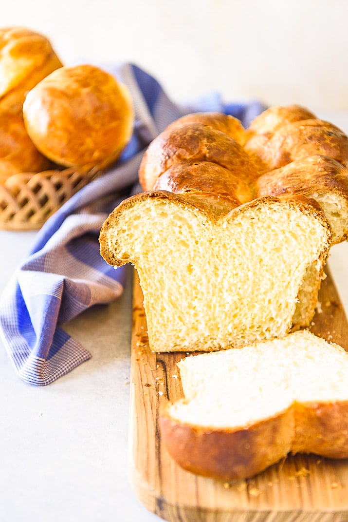 slices of brioche on cutting board with blue napkin