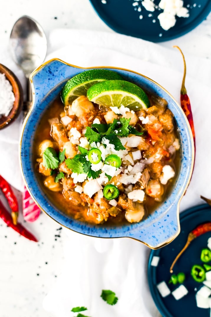 This Slow Cooker Posole (or Pozole) is a traditional Mexican stew made with hominy and pork and a flavorful broth that's super easy to make!